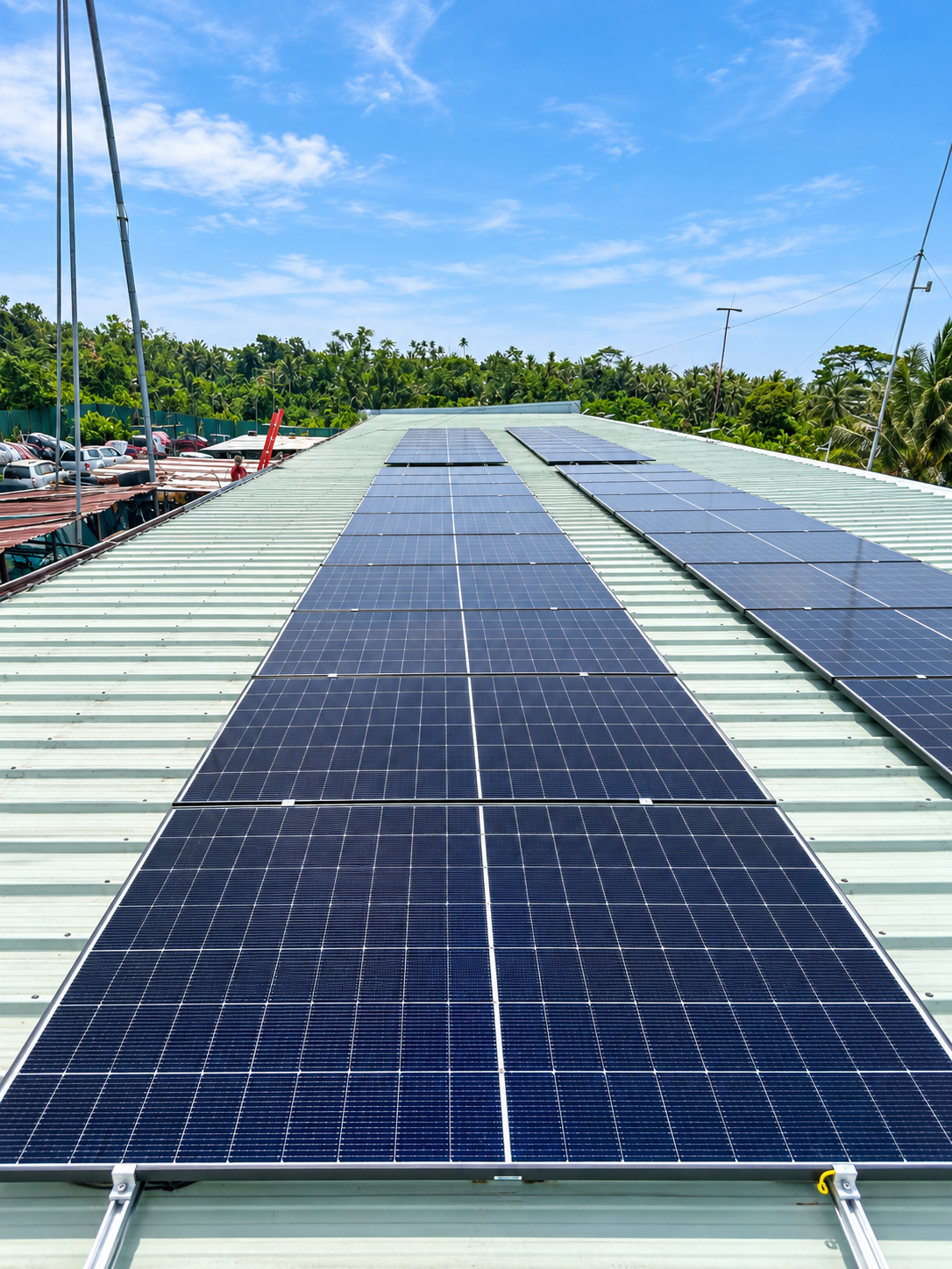 Large warehouse roof fitted with rows of solar panels